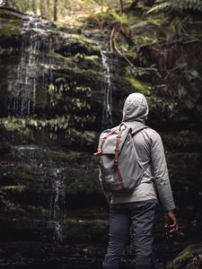 Preview wallpaper man, hood, backpack, waterfall