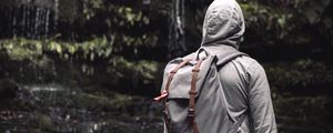 Preview wallpaper man, hood, backpack, waterfall