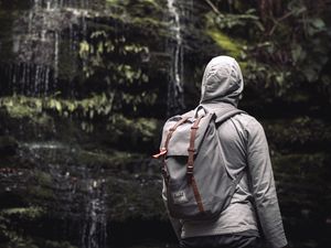 Preview wallpaper man, hood, backpack, waterfall