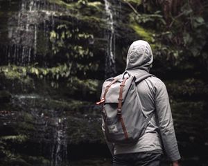 Preview wallpaper man, hood, backpack, waterfall