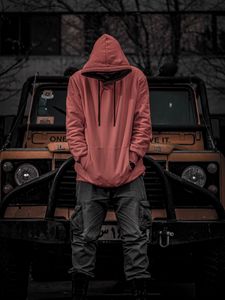 Preview wallpaper man, hood, hoodie, car, jeep