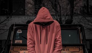 Preview wallpaper man, hood, hoodie, car, jeep