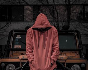 Preview wallpaper man, hood, hoodie, car, jeep