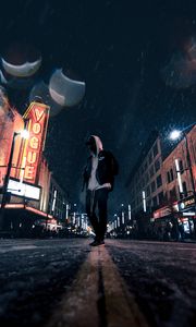 Preview wallpaper man, hood, night city, snowfall, street