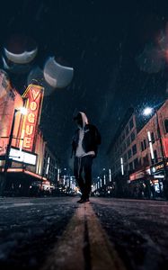 Preview wallpaper man, hood, night city, snowfall, street