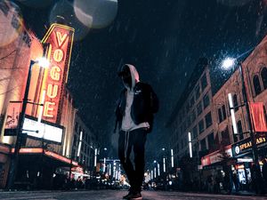 Preview wallpaper man, hood, night city, snowfall, street