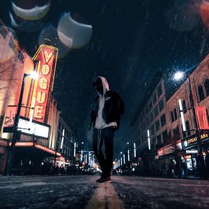 Preview wallpaper man, hood, night city, snowfall, street