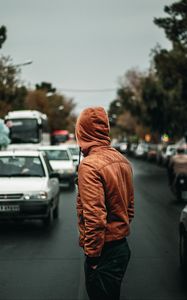 Preview wallpaper man, hood, road, street, cars