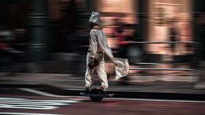 Preview wallpaper man, hoverboard, street, city, road