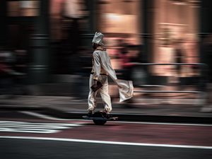 Preview wallpaper man, hoverboard, street, city, road