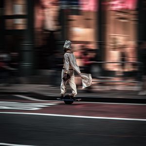 Preview wallpaper man, hoverboard, street, city, road