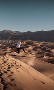 Preview wallpaper man, jump, desert, dunes, sand