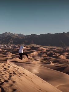 Preview wallpaper man, jump, desert, dunes, sand