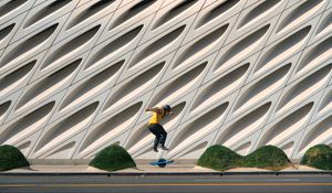 Preview wallpaper man, jump, electric unicycle, skate, trick, building