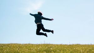 Preview wallpaper man, jump, freedom, free, field, nature