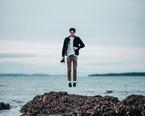 Preview wallpaper man, jump, levitation, sea, coast