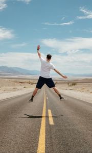 Preview wallpaper man, jump, levitation, road, desert