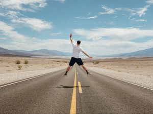 Preview wallpaper man, jump, levitation, road, desert