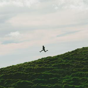 Preview wallpaper man, jump, minimalism, sky, grass