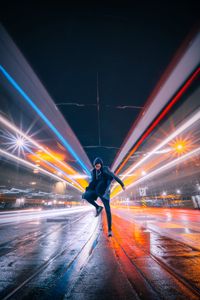 Preview wallpaper man, jump, night city, long exposure