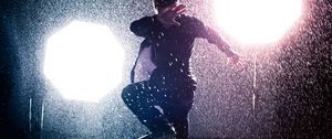 Preview wallpaper man, jump, rain, light