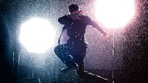 Preview wallpaper man, jump, rain, light