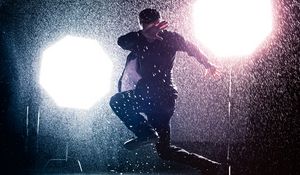 Preview wallpaper man, jump, rain, light