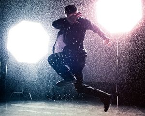 Preview wallpaper man, jump, rain, light