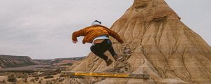 Preview wallpaper man, jump, trick, rock, sand