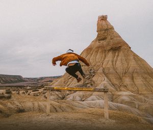 Preview wallpaper man, jump, trick, rock, sand