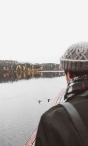 Preview wallpaper man, lake, sad, shore, pier, nature