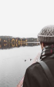 Preview wallpaper man, lake, sad, shore, pier, nature