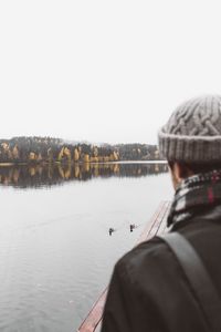 Preview wallpaper man, lake, sad, shore, pier, nature