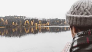 Preview wallpaper man, lake, sad, shore, pier, nature