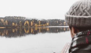 Preview wallpaper man, lake, sad, shore, pier, nature