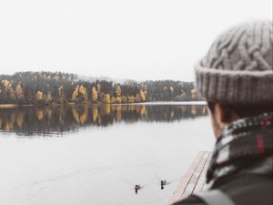 Preview wallpaper man, lake, sad, shore, pier, nature