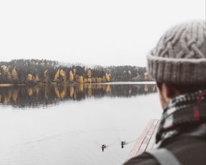 Preview wallpaper man, lake, sad, shore, pier, nature