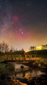 Preview wallpaper man, lantern, bridge, night, starry sky, dark