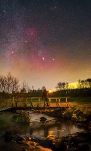 Preview wallpaper man, lantern, bridge, night, starry sky, dark