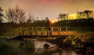 Preview wallpaper man, lantern, bridge, night, starry sky, dark