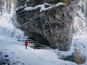 Preview wallpaper man, loneliness, alone, rocks, snowy