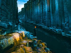 Preview wallpaper man, loneliness, alone, rocks, river