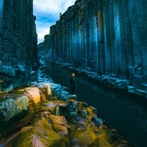 Preview wallpaper man, loneliness, alone, rocks, river