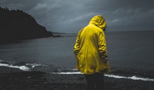 Preview wallpaper man, loneliness, alone, cloak, coast
