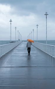 Preview wallpaper man, loneliness, alone, pier, umbrella