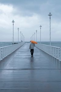 Preview wallpaper man, loneliness, alone, pier, umbrella