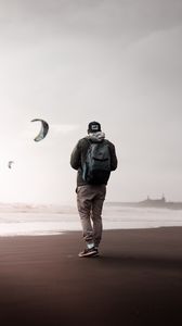 Preview wallpaper man, loneliness, alone, style, paragliders, coast