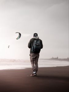 Preview wallpaper man, loneliness, alone, style, paragliders, coast