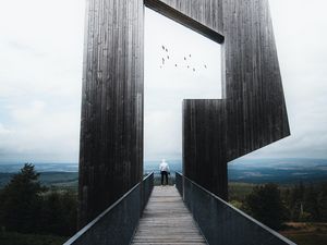 Preview wallpaper man, loneliness, alone, architecture, construction, wooden