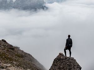 Preview wallpaper man, loneliness, alone, traveler, rocks, fog